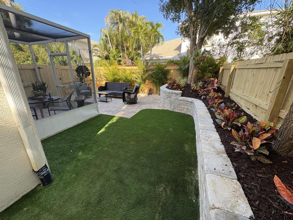 Indian Harbour Beach landscape after lawn improvement and hardscape installation
